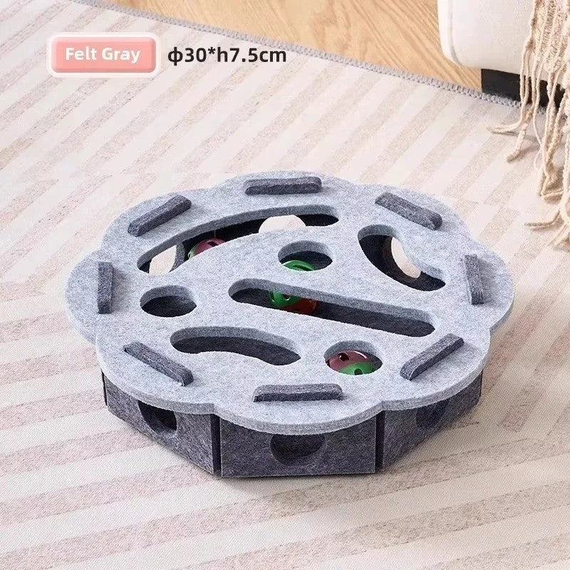 Cat playing independently with the felt maze puzzle toy